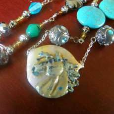 Horse head relief lental bead necklace.
