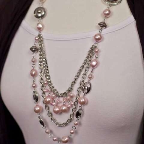 Silver necklace with pink ribbon