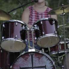 Sheryl drumming and worshipping