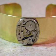 Cuff bracelet with watch part