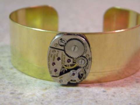 Cuff bracelet with watch part