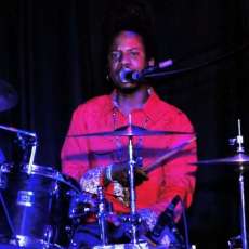 Drumming and rapping at the same time!