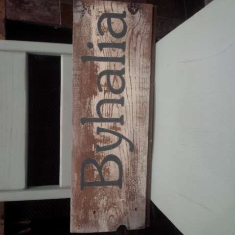 Blue chair with Byhalia sign