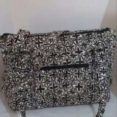 Large Carpet Bag Tote-$45.00- Approx. 18Wide X 15 Height- Front Zipper Pocket- 2 Side Snap Flap Pockets-Inside Zipper Pocket.