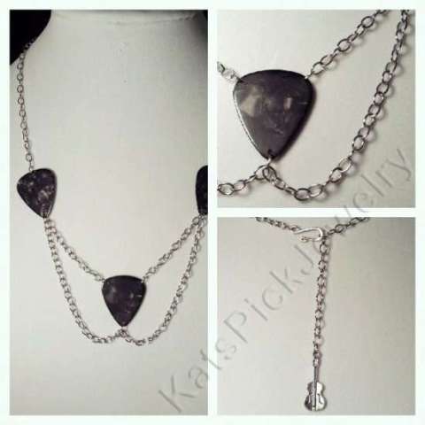 Gray guitar picks with draped chain necklace