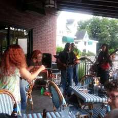 At Ferris Steak House (The Cars Driving by As We Played Was Much Fun)