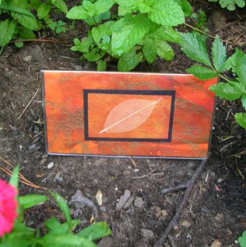 Checkbook cover orange with skeleton leaf