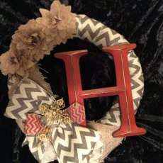 Wreath With Flowers and a Letter.