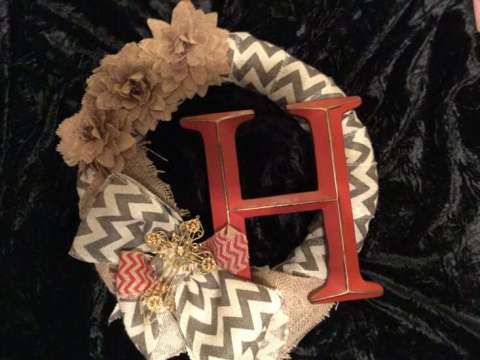 Wreath With Flowers and a Letter.