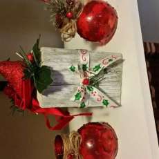 Cardinal on Block With 2 Candleholders