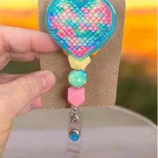 The Scaled Heart Badge Reel