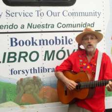 Jon Sundell in Front of Forsyth County Pub Libs' Hispanic Bookmobile