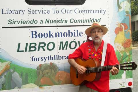 Jon Sundell in Front of Forsyth County Pub Libs' Hispanic Bookmobile