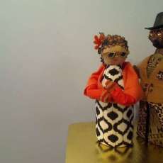 Hairdo Crafted From Pine Cone Petals, Bodies Are Tomato and Apple Juice Bottles