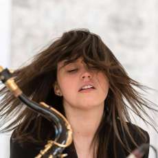 Hannah With Sax Player