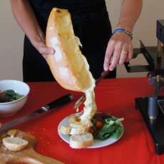 Raclette Cheese Smothering the Food