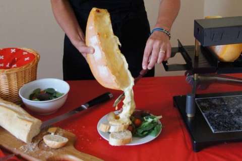 Raclette Cheese Smothering the Food