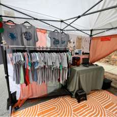 Left Side Tent Setup - Shirts and Laser Station