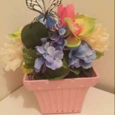 Blue Flowers With Pink Metal Container