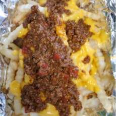 French Fries, Fried in 100% Canola Oil and Covered With Homemade Chili and Cheese