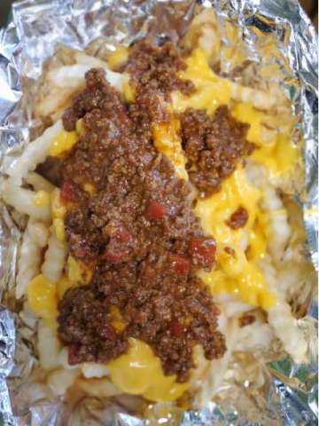 French Fries, Fried in 100% Canola Oil and Covered With Homemade Chili and Cheese