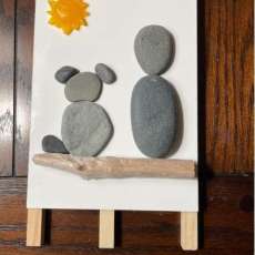 Rock and Resin Person and Dog on Log