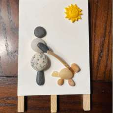 Rock and Resin Woman Walking Dog