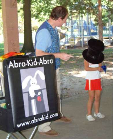 Fun With Kids at Outdoor Festival Magic Show