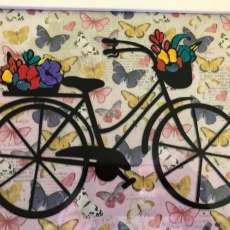 Framed Bicycle With Flowers in the Baskets