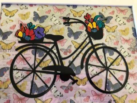 Framed Bicycle With Flowers in the Baskets