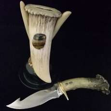 Carved Deer Antler Handle Knife With Elk Antler Sheath and Elk Antler and Bronze Stand.