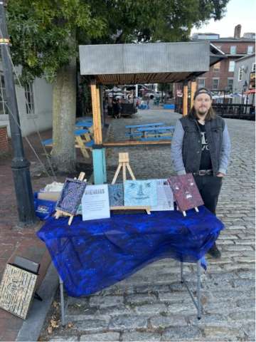 Trying to Sell Gremlins to Passersby in Portland, Maine.