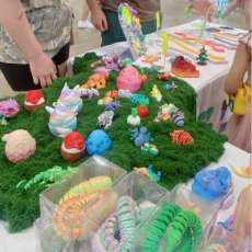 Busy Booth With Colorful Articulated Dragons