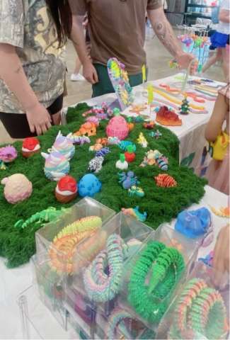 Busy Booth With Colorful Articulated Dragons