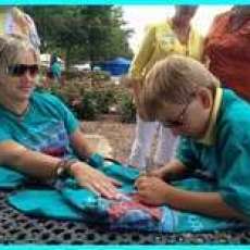 T-shirt artists Carson Dowsey autographing T-shirts