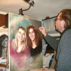 Working on an oil portrait in 2010, Florida, with a charcoal sketch in the background