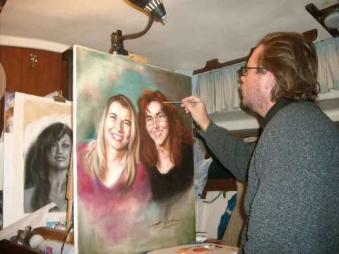 Working on an oil portrait in 2010, Florida, with a charcoal sketch in the background