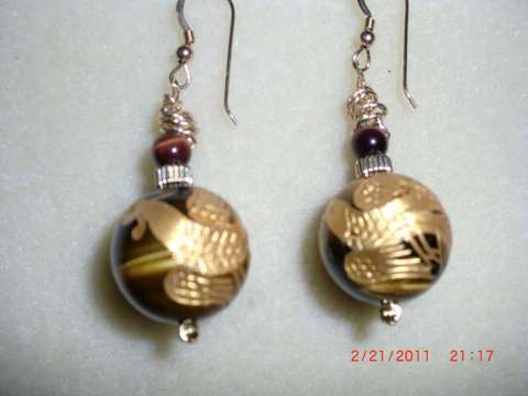 Tiger eye earrings with golden dragon etched in them