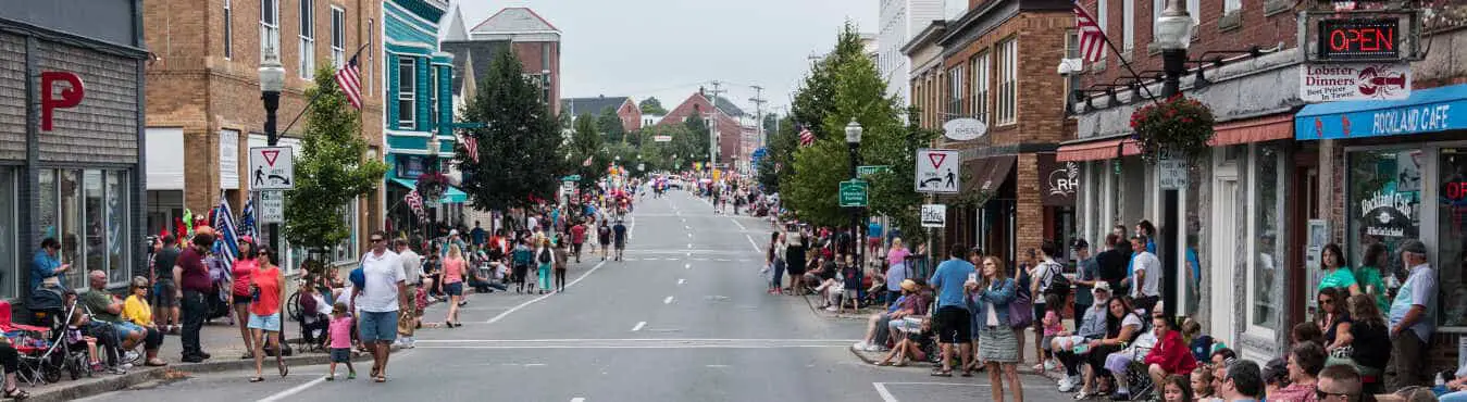 People line the streets of Rockland, Maine to enjoy the annual Lobster festival parade.