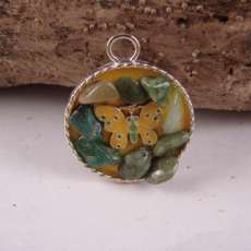 round silver pendant with yellow butterfly