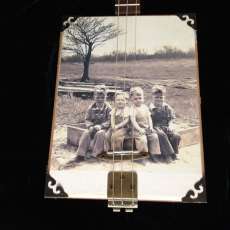 Your photo on canvas on a cigar box guitar