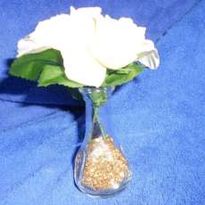 White silk roses (2) - small arrangement placed in small vase with golden flakes as vase filler