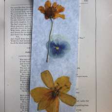 Yellow lily, blue pansy and yellow coreopsis pressed flower bookmark