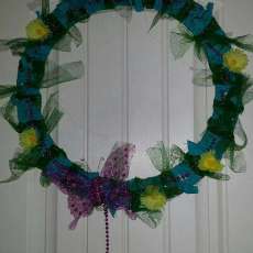Green,  yellow, & purple fabric wreath with flowers and butterfly