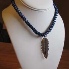 Silver Feather on a Blue and Silver 15 1/2" Braided Chain