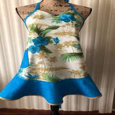 Ladies blue apron with palm trees.