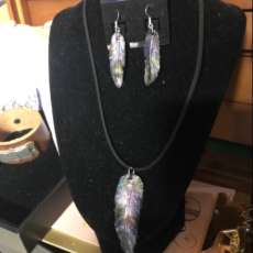 Handmade leather feather with earrings to match