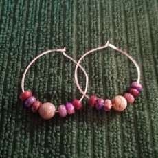 Hoop earrings with stone beads.