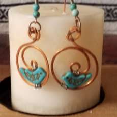 Turquoise birds on spiral copper