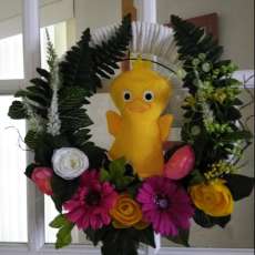 Nursery wreath with yellow duck and flowers with glitter jewels